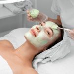 a women is getting green peel treatment